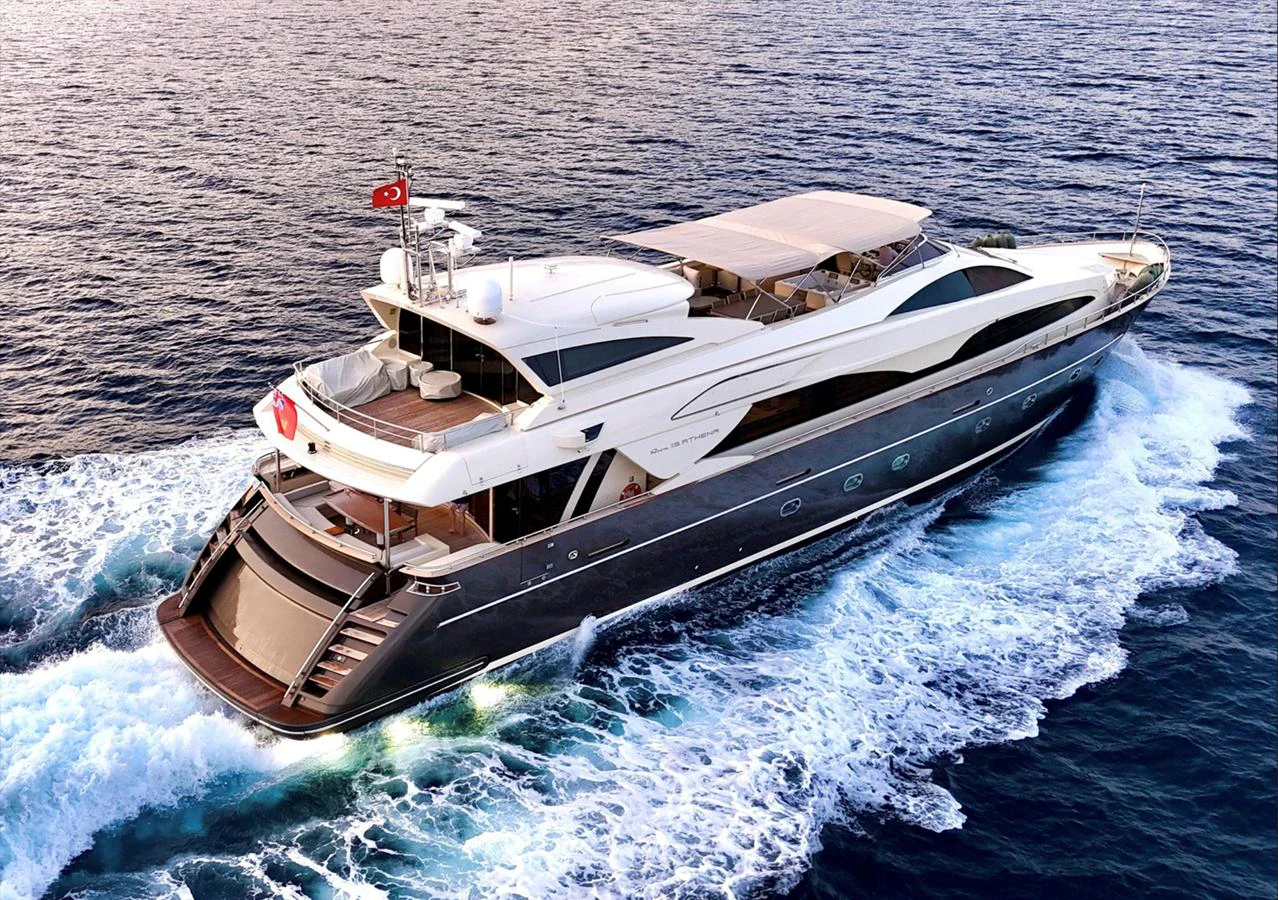 A luxurious yacht cruises through the open sea, showcasing its sleek design and spacious decks. aboard RIVA 115 Yacht for Sale