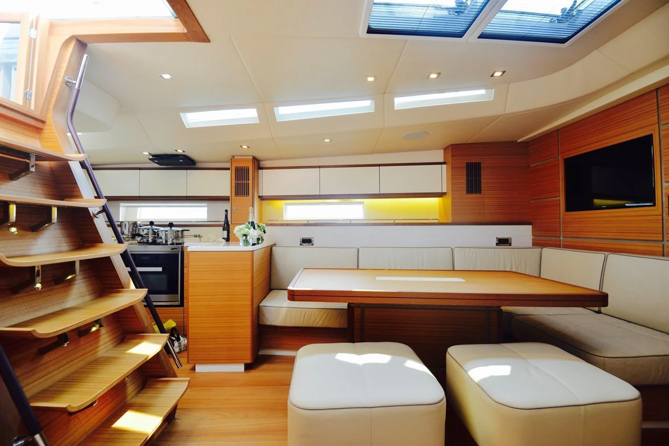 The yacht's salon features a modern design with ample natural light and comfortable seating. aboard MAZARIN 72 CRUISER RACER Yacht for Sale