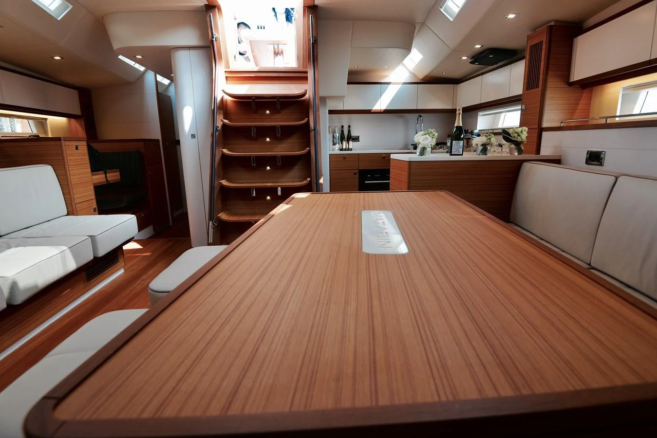 The salon features a spacious dining area with elegant wood finishes and ample natural light. aboard MAZARIN 72 CRUISER RACER Yacht for Sale