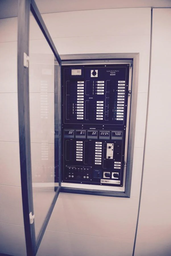 The image shows an open electrical panel with various switches and controls. aboard MAZARIN 72 CRUISER RACER Yacht for Sale