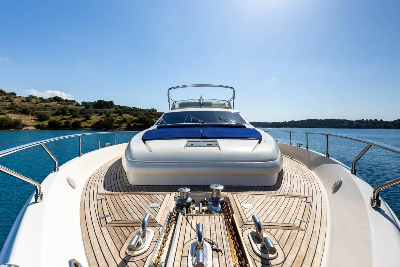 The yacht's foredeck offers a spacious and inviting area with sun pads and a clear view of the serene waters. aboard PUMABAY Yacht for Sale