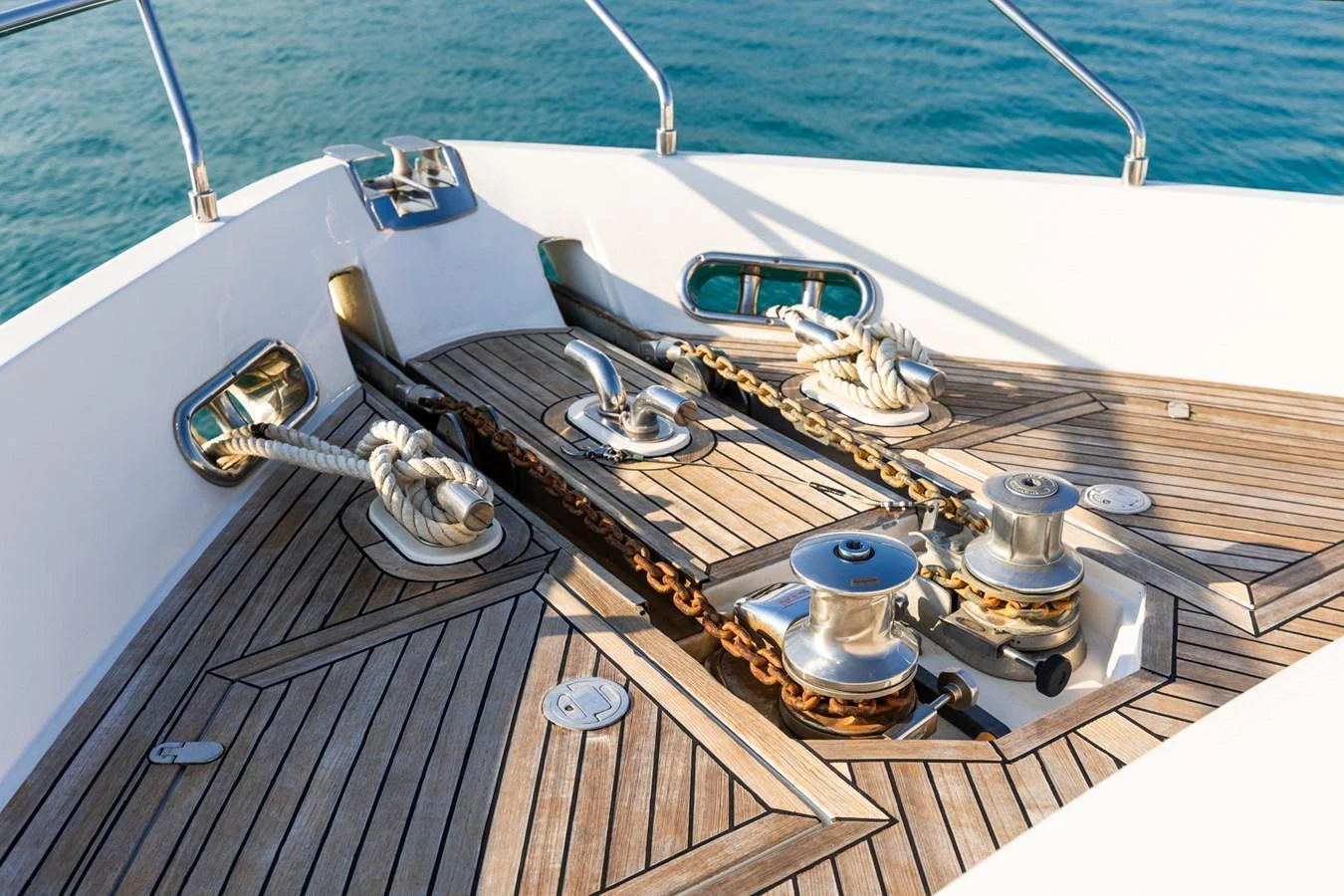 The yacht's bow features a well-maintained anchor system with polished metal fittings and teak decking. aboard PUMABAY Yacht for Sale