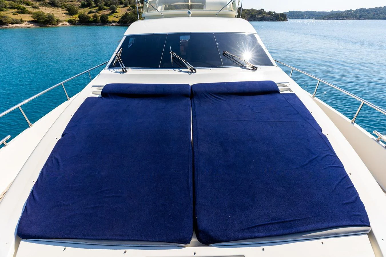 The foredeck features spacious sun pads with a stunning view of the surrounding waters. aboard PUMABAY Yacht for Sale