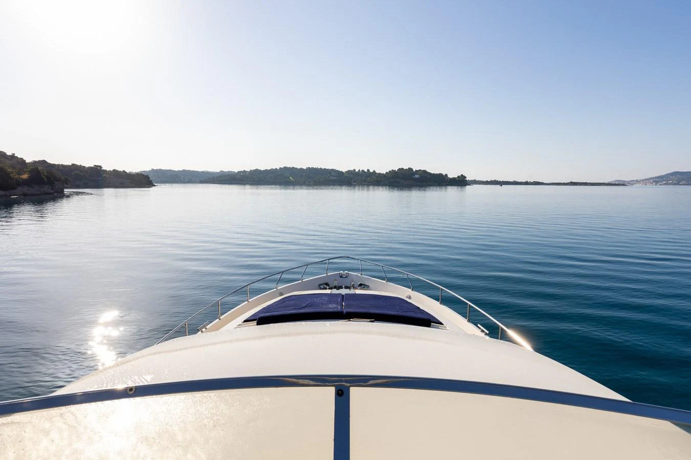 The yacht glides smoothly over calm waters, offering a serene and picturesque view from the bow. aboard PUMABAY Yacht for Sale