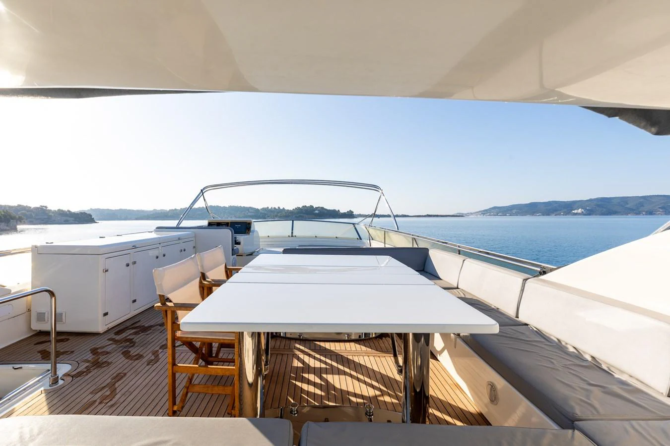 The flybridge offers a spacious and inviting area for alfresco dining with stunning views. aboard PUMABAY Yacht for Sale