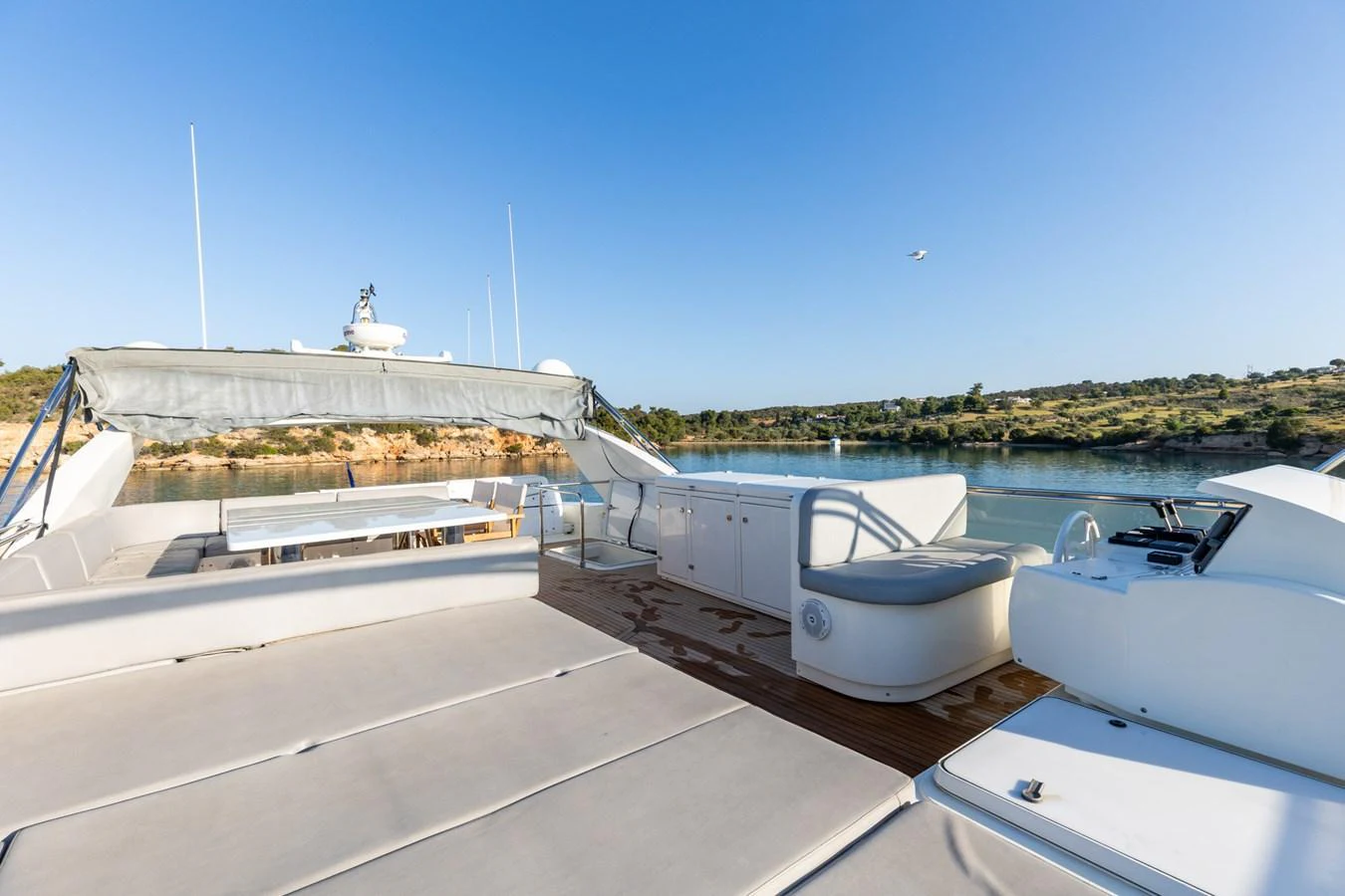 The flybridge offers spacious seating and stunning views of the surrounding waters. aboard PUMABAY Yacht for Sale