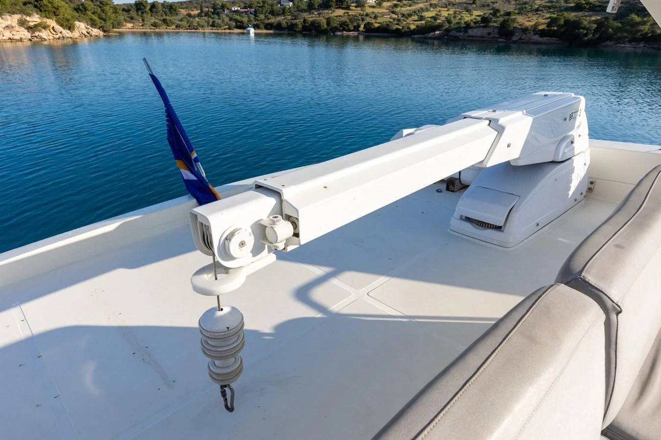 The image showcases a yacht's crane system on the deck, designed for handling tenders or toys. aboard PUMABAY Yacht for Sale