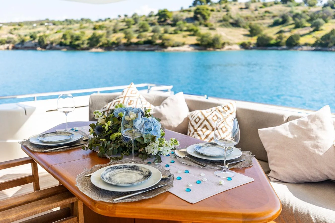 An inviting alfresco dining setup on the yacht's deck, overlooking serene waters. aboard PUMABAY Yacht for Sale