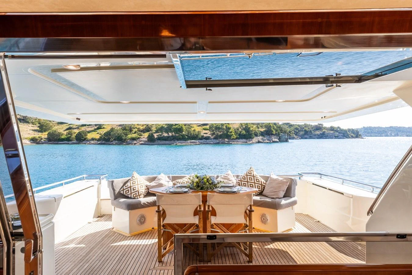 The aft deck offers a luxurious outdoor dining area with stunning views of the surrounding waters. aboard PUMABAY Yacht for Sale