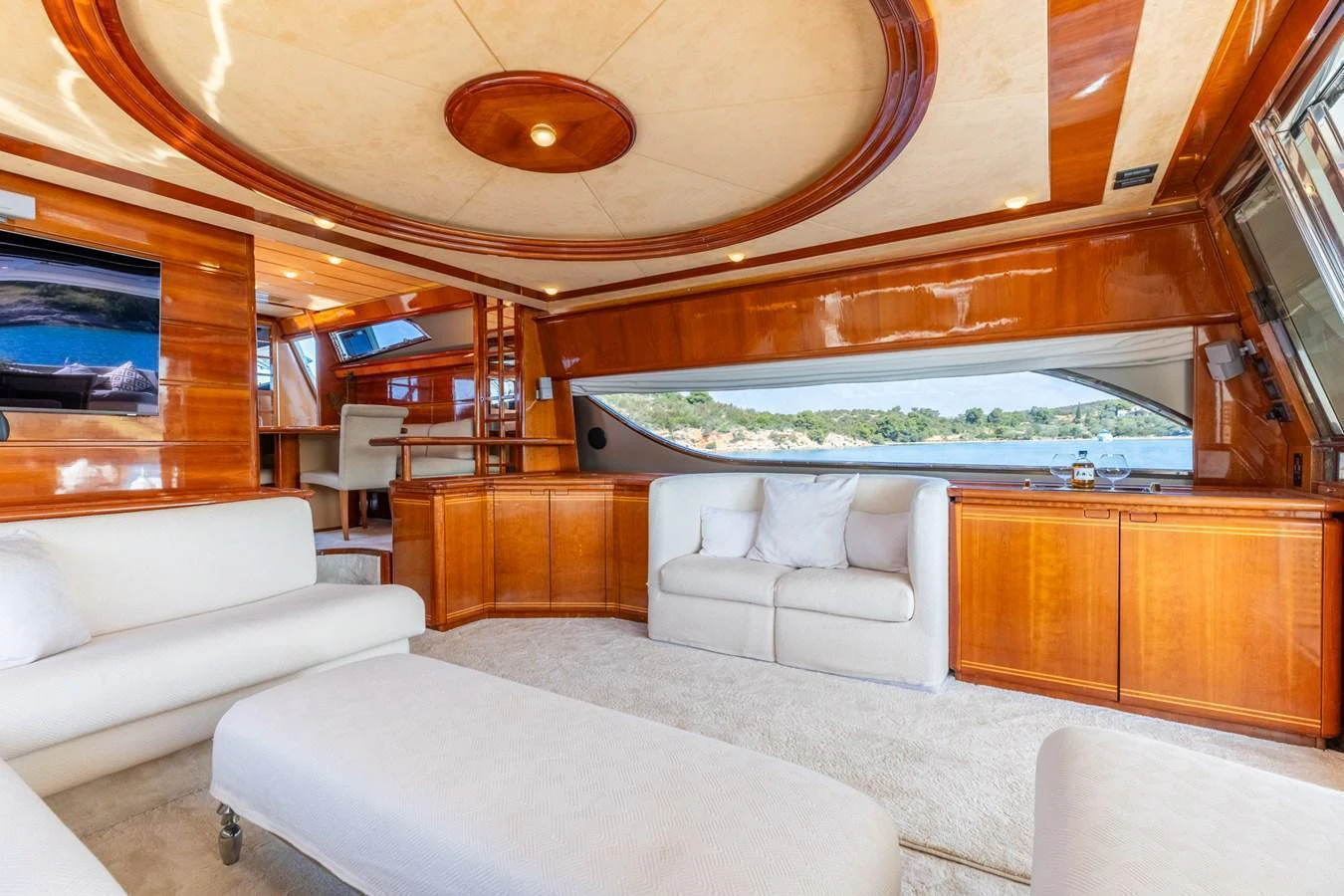 The salon features luxurious seating with panoramic windows offering stunning views. aboard PUMABAY Yacht for Sale