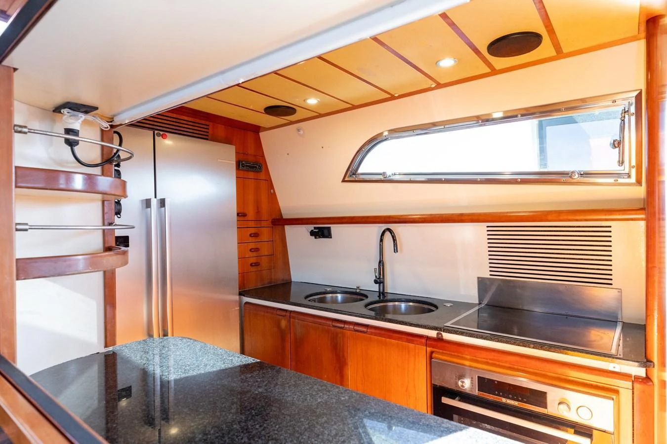 The yacht's galley features modern appliances and a sleek design with ample counter space. aboard PUMABAY Yacht for Sale