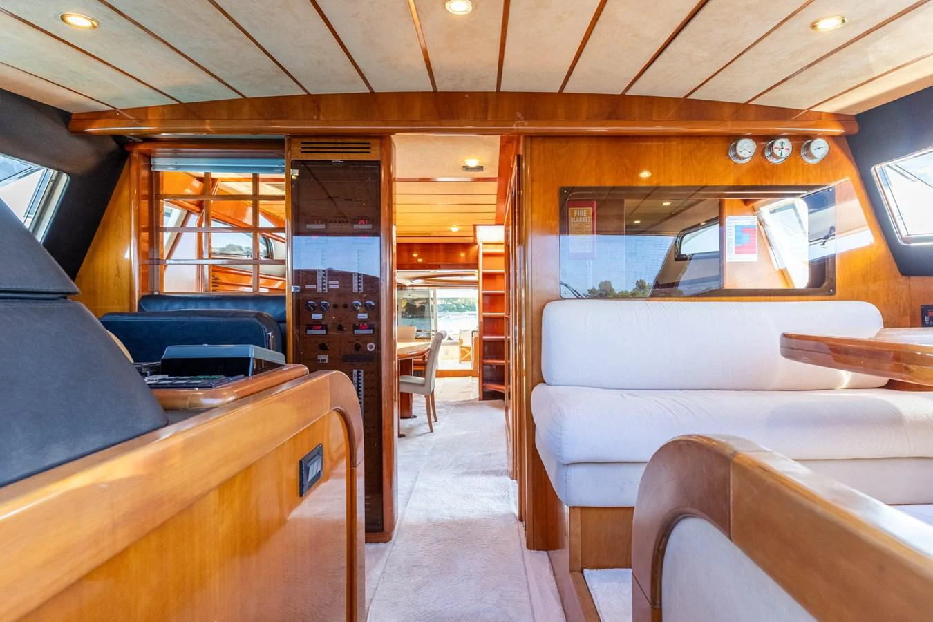 The salon features luxurious wood finishes and comfortable seating, creating a warm and inviting atmosphere. aboard PUMABAY Yacht for Sale