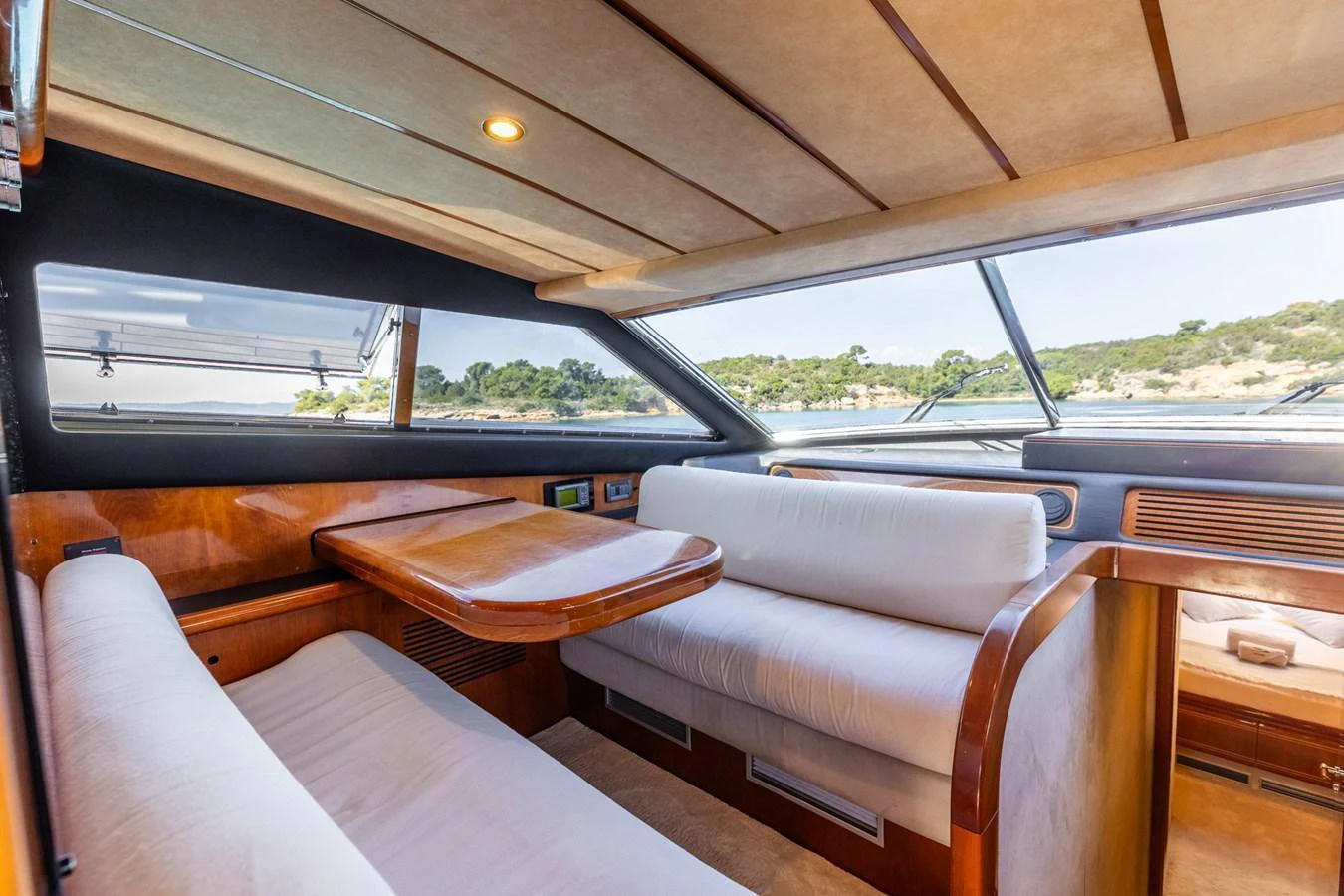 The yacht's salon features comfortable seating and large windows offering scenic views. aboard PUMABAY Yacht for Sale