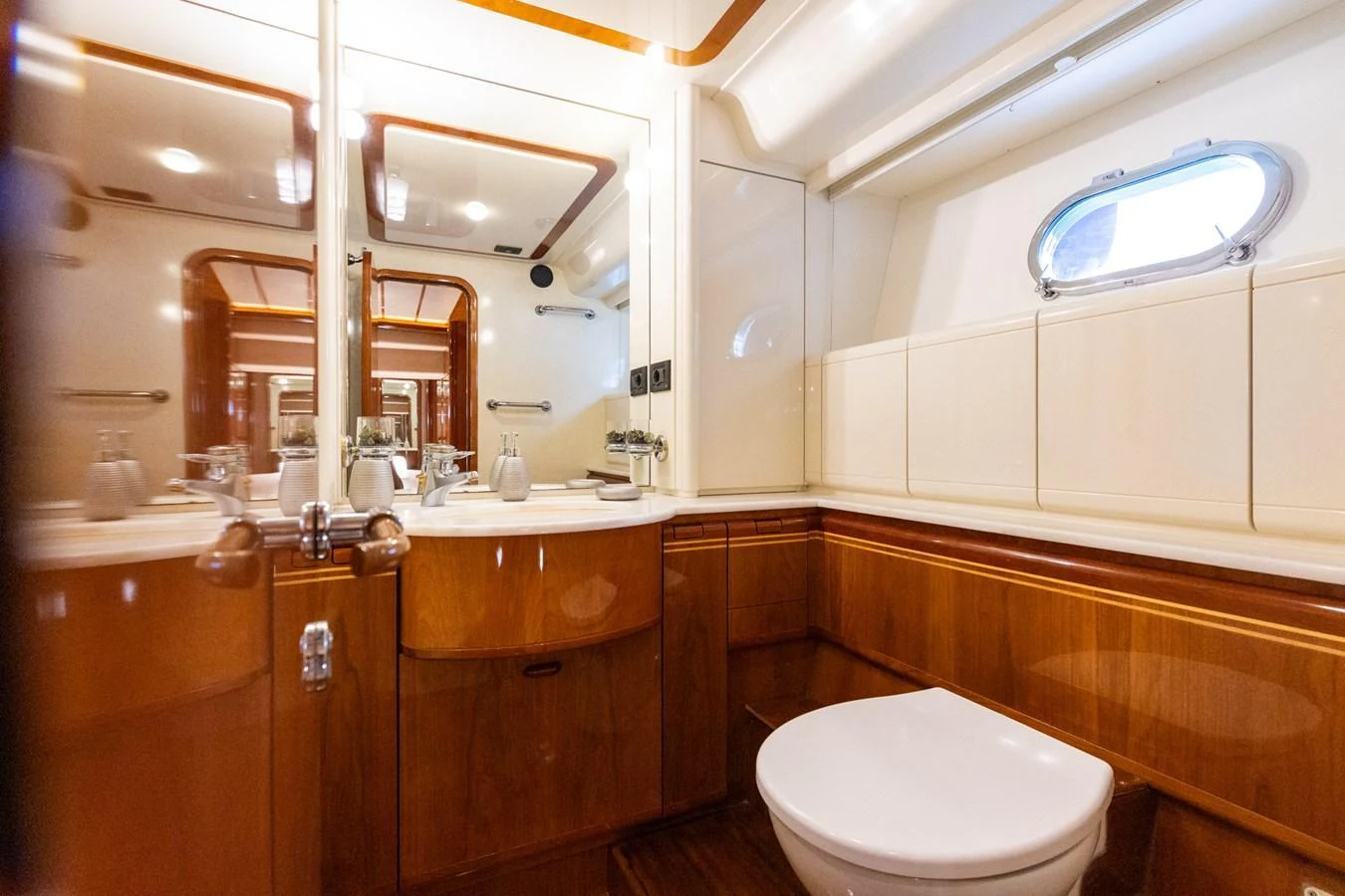 The yacht's bathroom features elegant wood finishes and modern fixtures. aboard PUMABAY Yacht for Sale