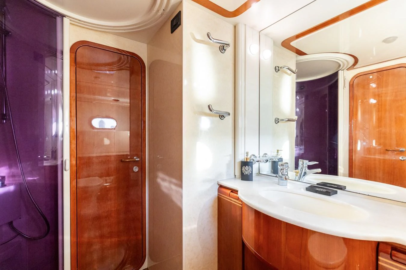 The yacht's bathroom features elegant wood finishes and modern fixtures. aboard PUMABAY Yacht for Sale