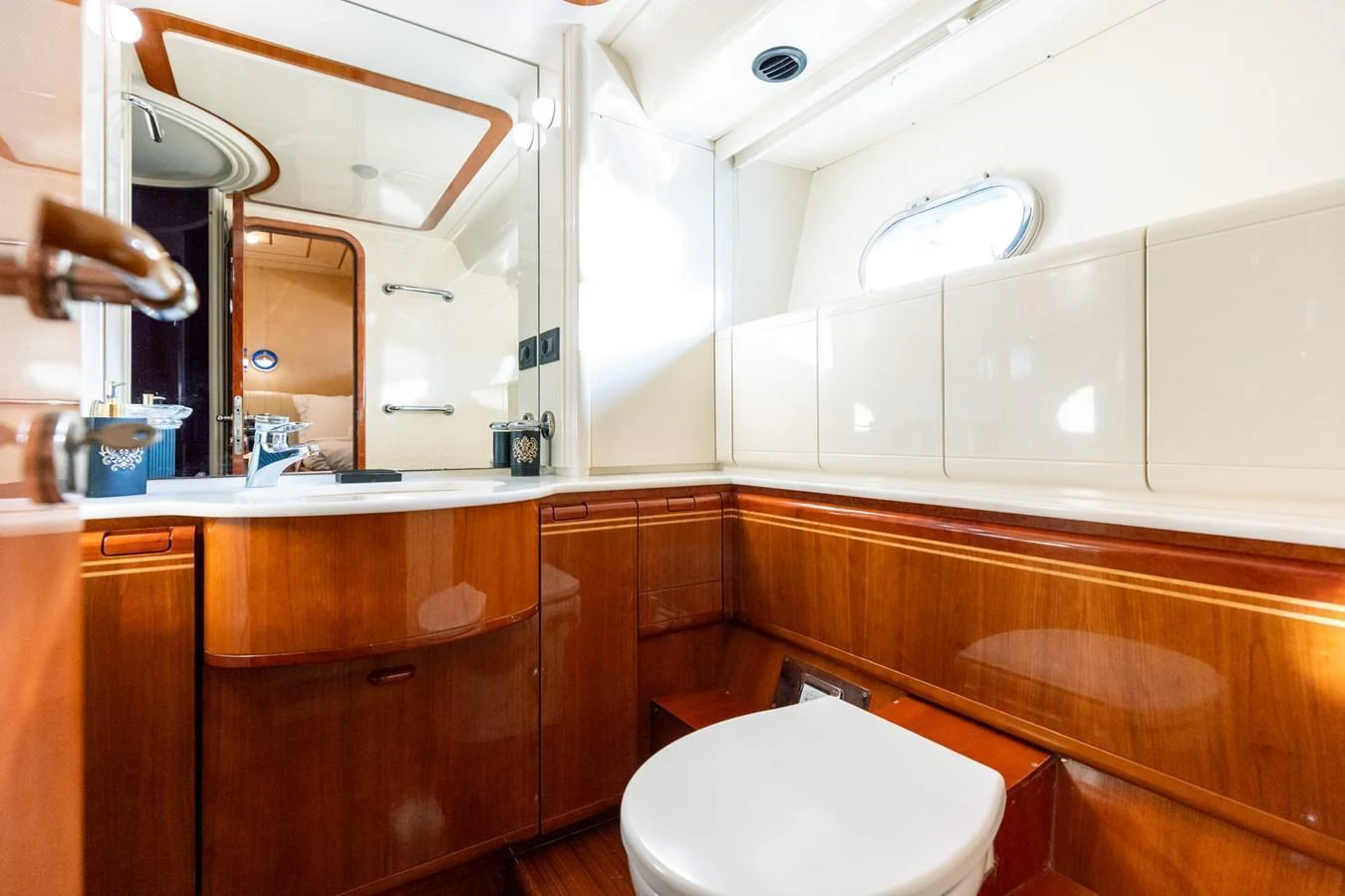 The yacht's bathroom features elegant wooden cabinetry and modern fixtures. aboard PUMABAY Yacht for Sale