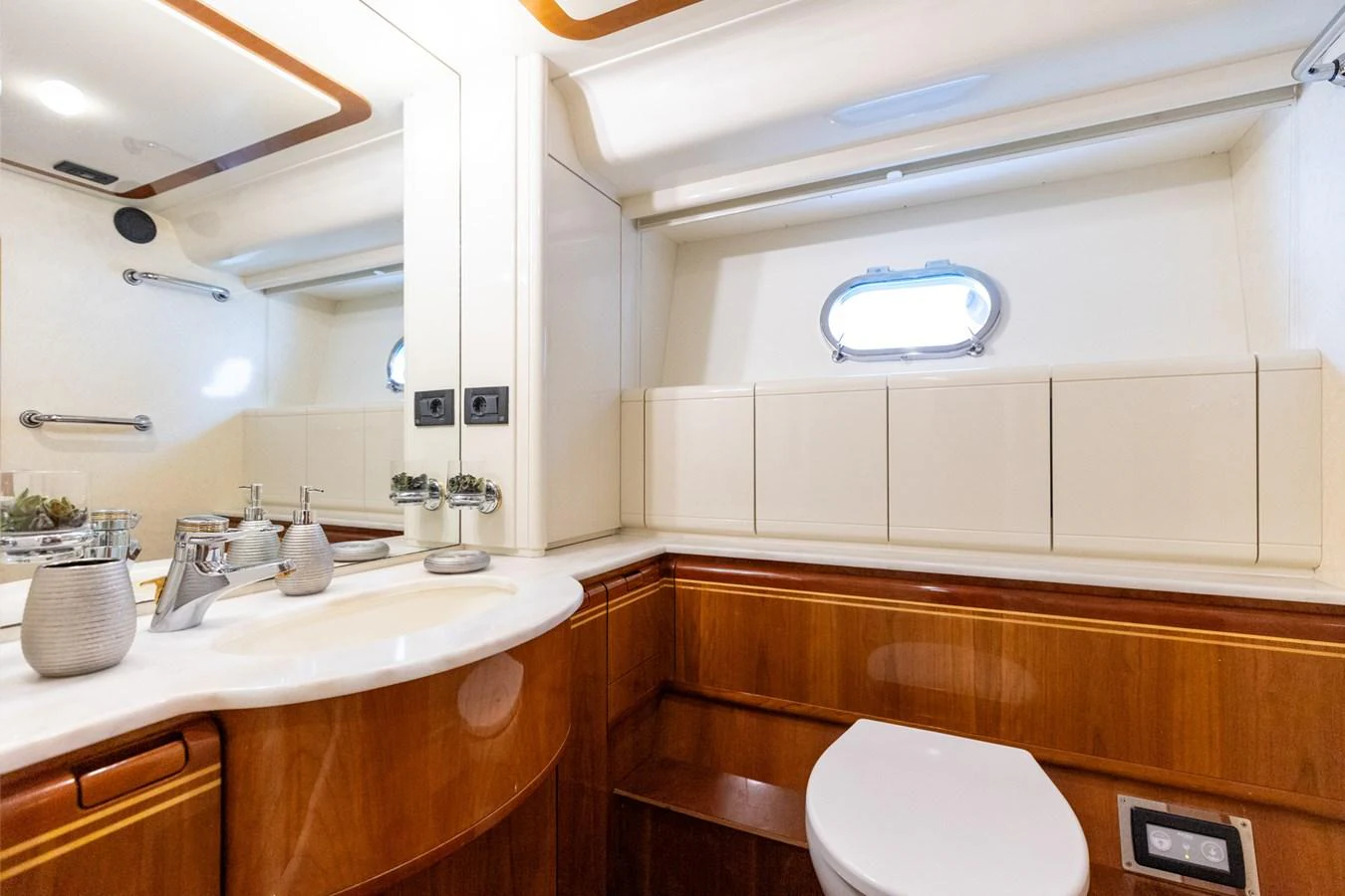 The yacht's bathroom features elegant wood accents and modern fixtures. aboard PUMABAY Yacht for Sale