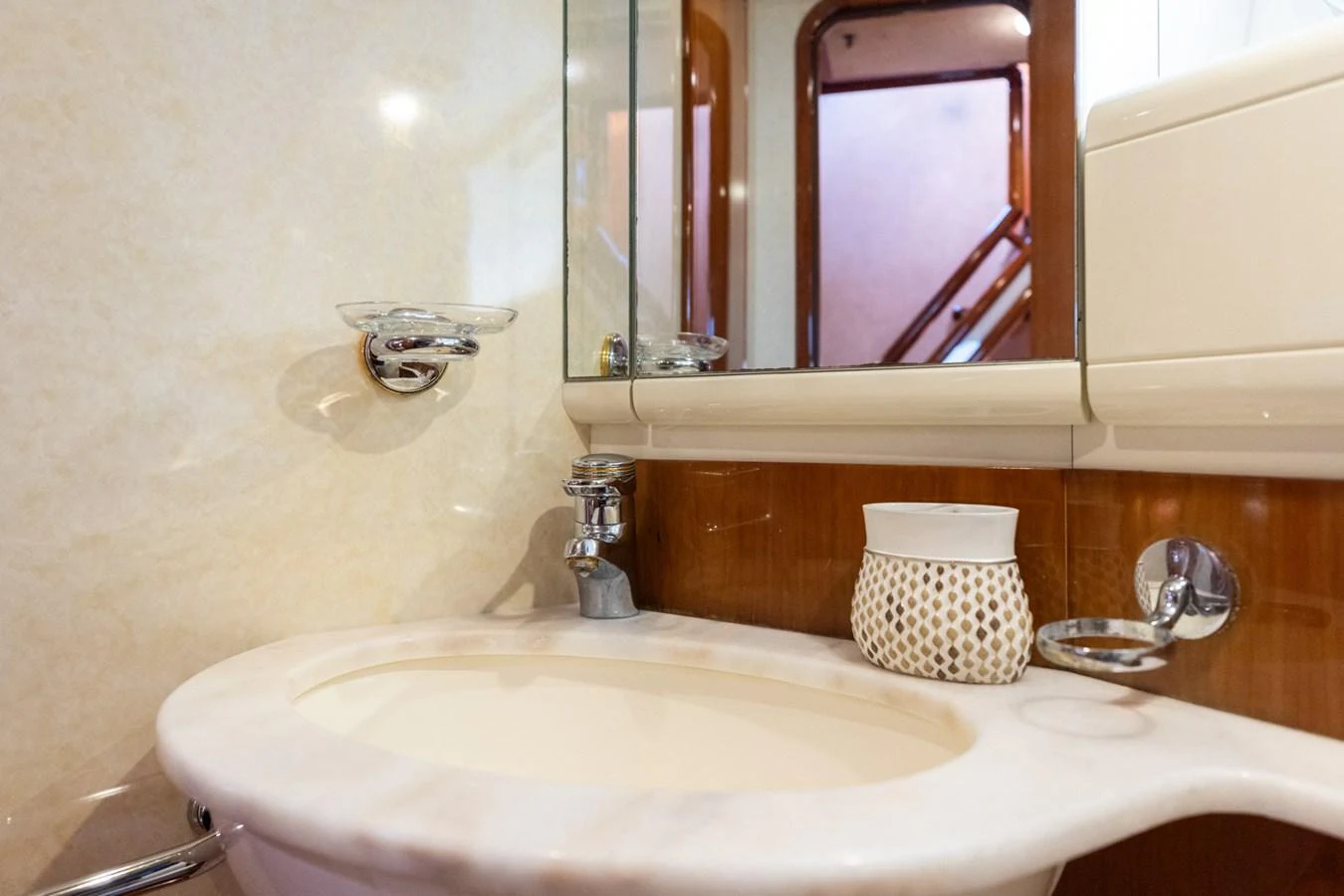 A well-appointed yacht bathroom featuring a sleek sink and elegant fixtures. aboard PUMABAY Yacht for Sale