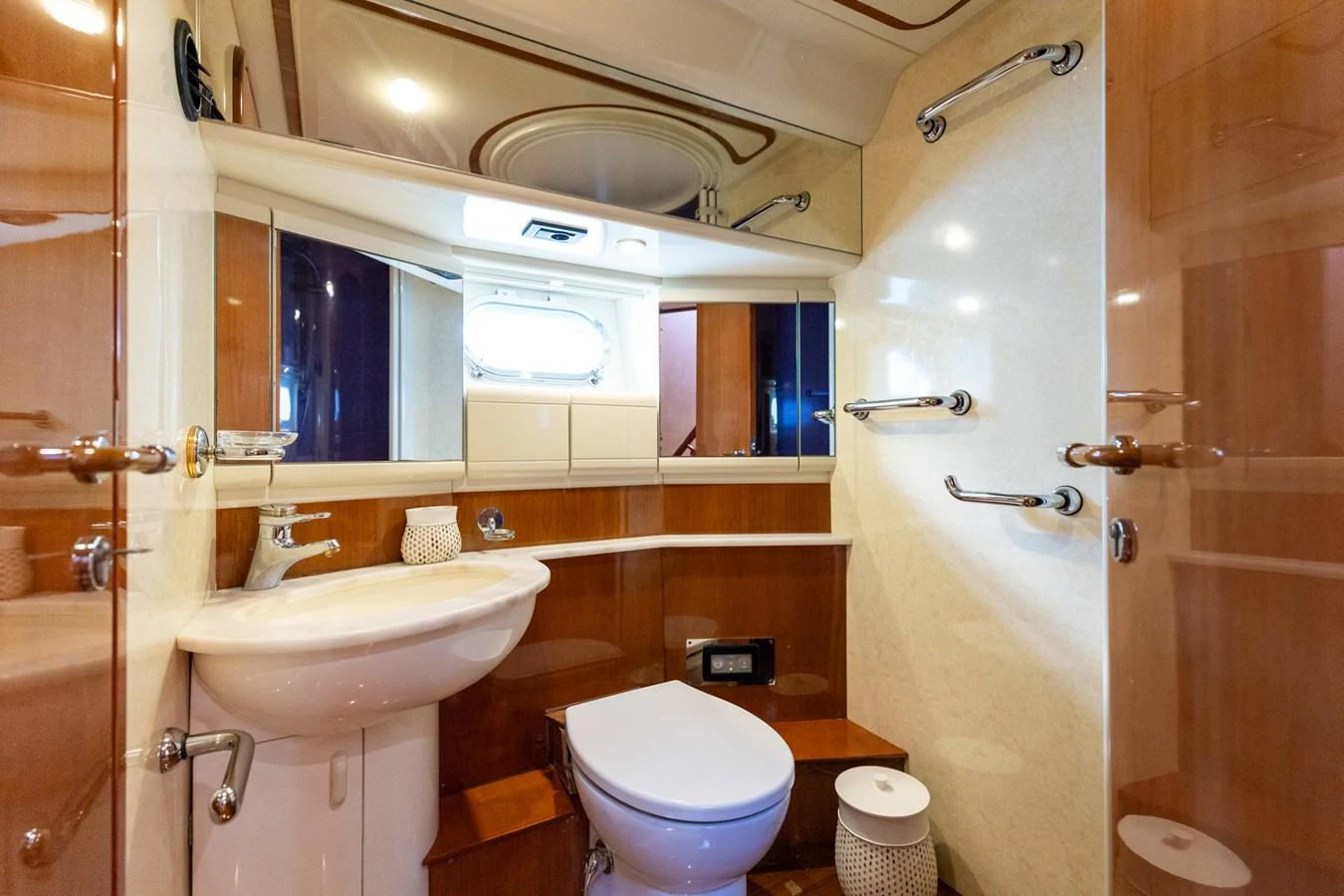 The yacht's bathroom features elegant wood paneling and modern fixtures. aboard PUMABAY Yacht for Sale