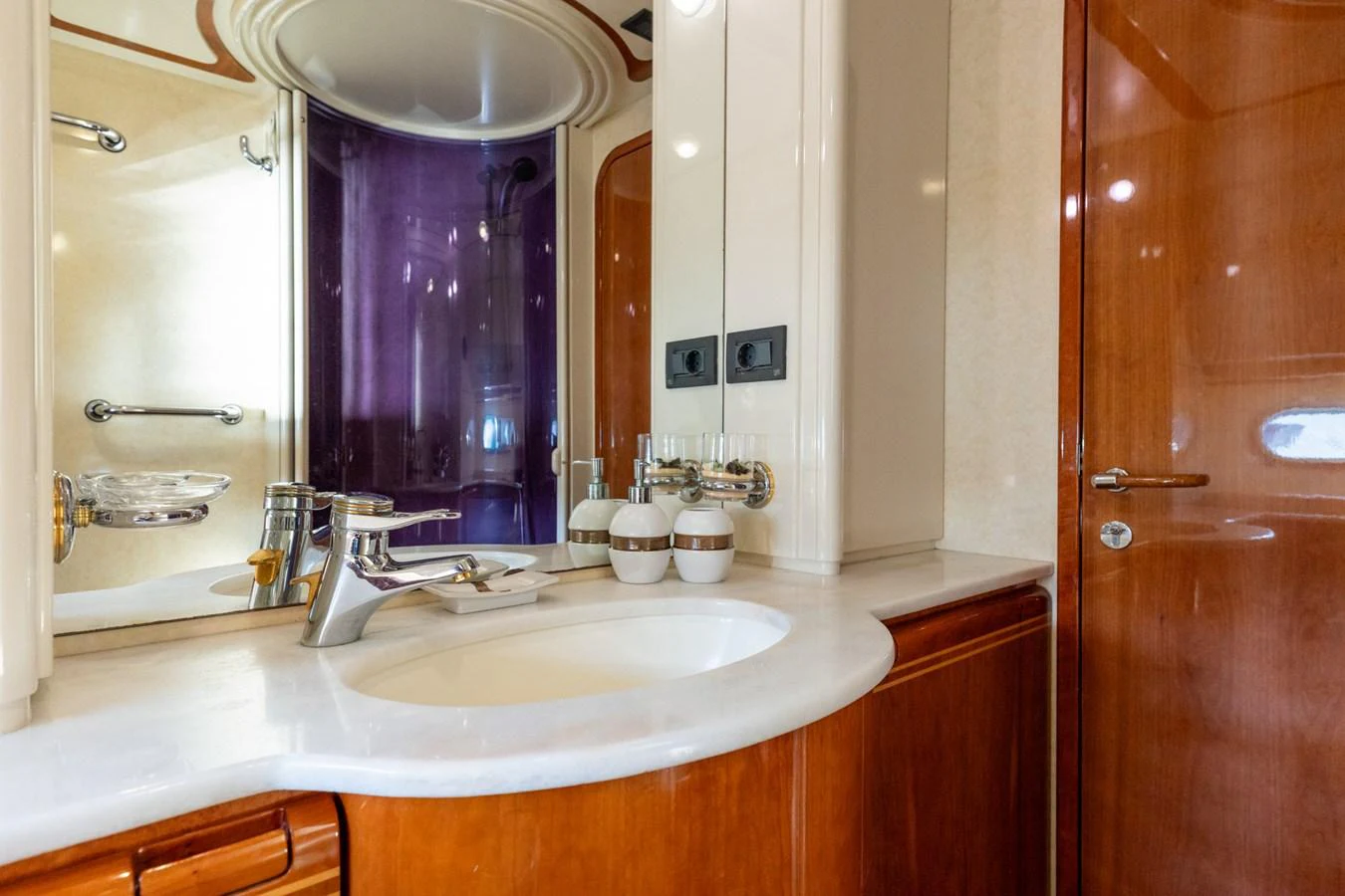 The yacht's bathroom features elegant fixtures and a polished wooden finish. aboard PUMABAY Yacht for Sale