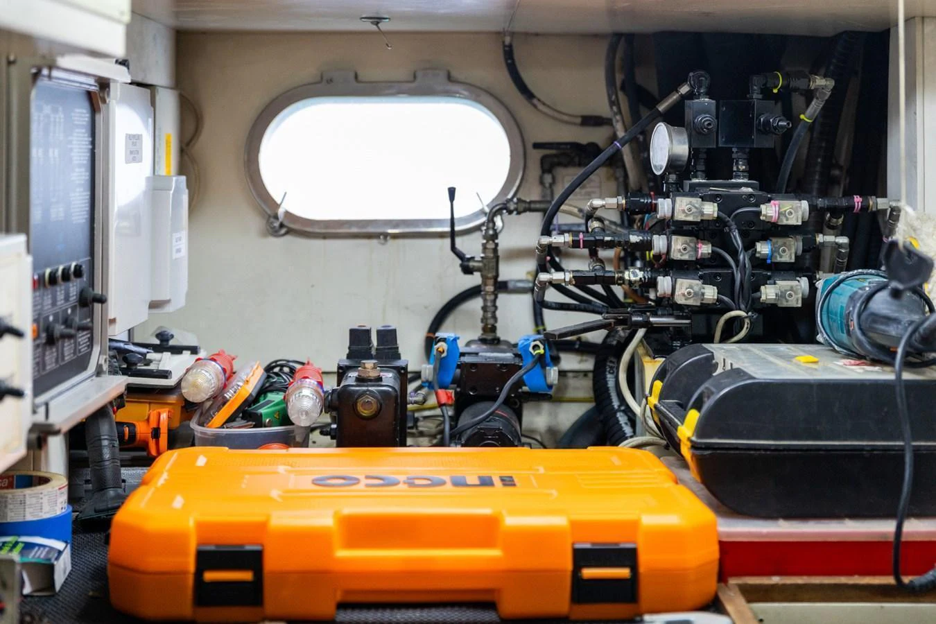 A detailed view of the yacht's technical equipment and tools in a maintenance area. aboard PUMABAY Yacht for Sale