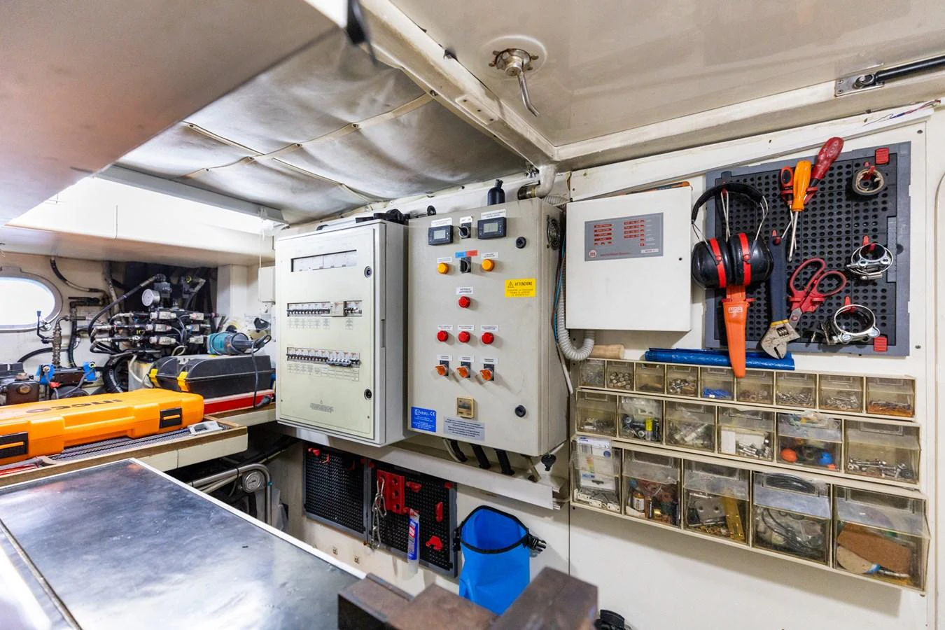 The yacht's engine room is equipped with various control panels, tools, and storage compartments, showcasing its well-organized and functional design. aboard PUMABAY Yacht for Sale