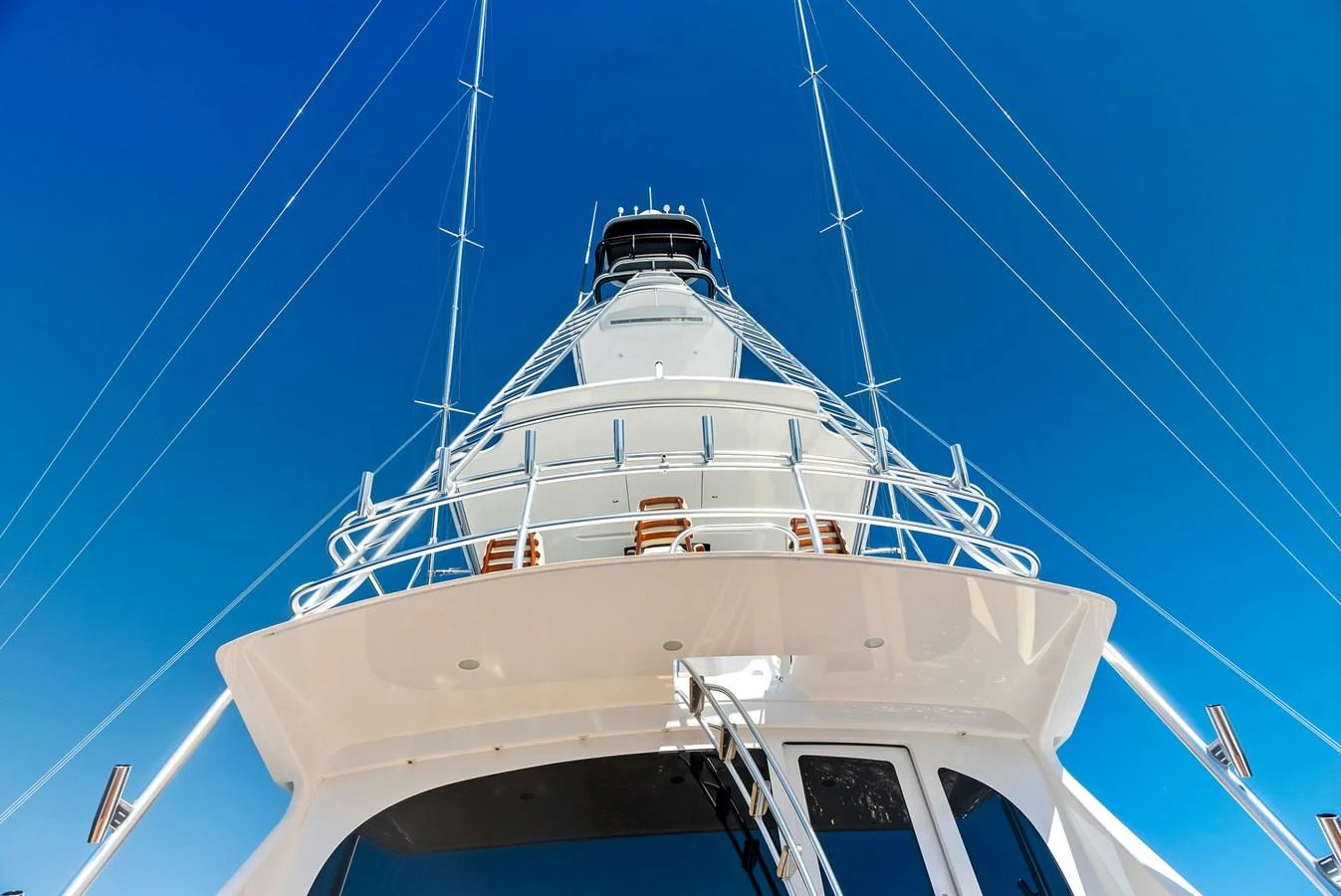 A striking view of the yacht's tower against a clear blue sky. aboard CATCH 23 Yacht for Sale