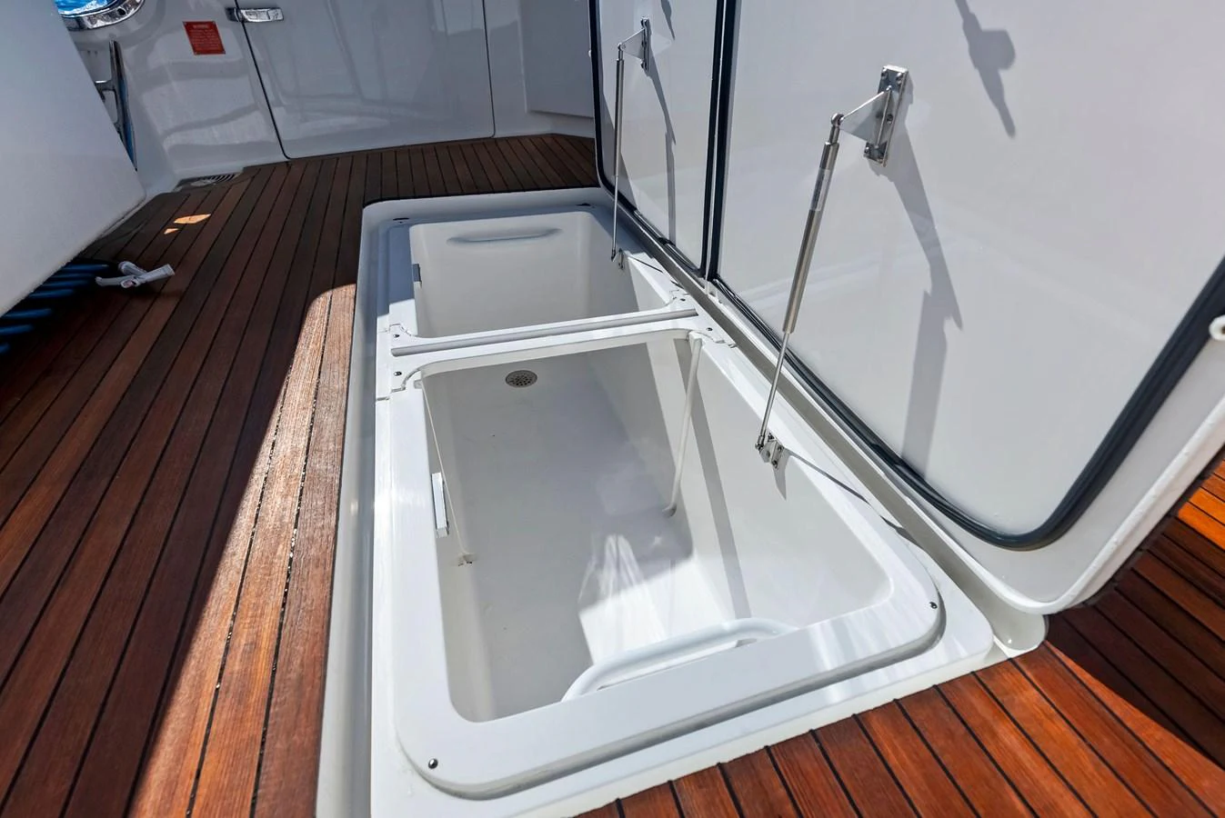 The image showcases a storage compartment on the yacht's deck, highlighting practical storage solutions. aboard CATCH 23 Yacht for Sale