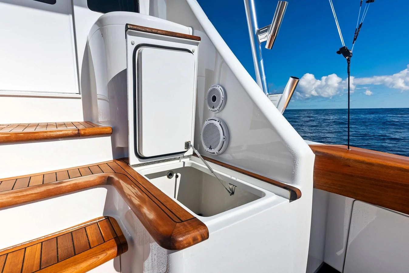 This image showcases a well-designed bait station on the yacht's deck, featuring wooden accents and a clean, functional layout. aboard CATCH 23 Yacht for Sale