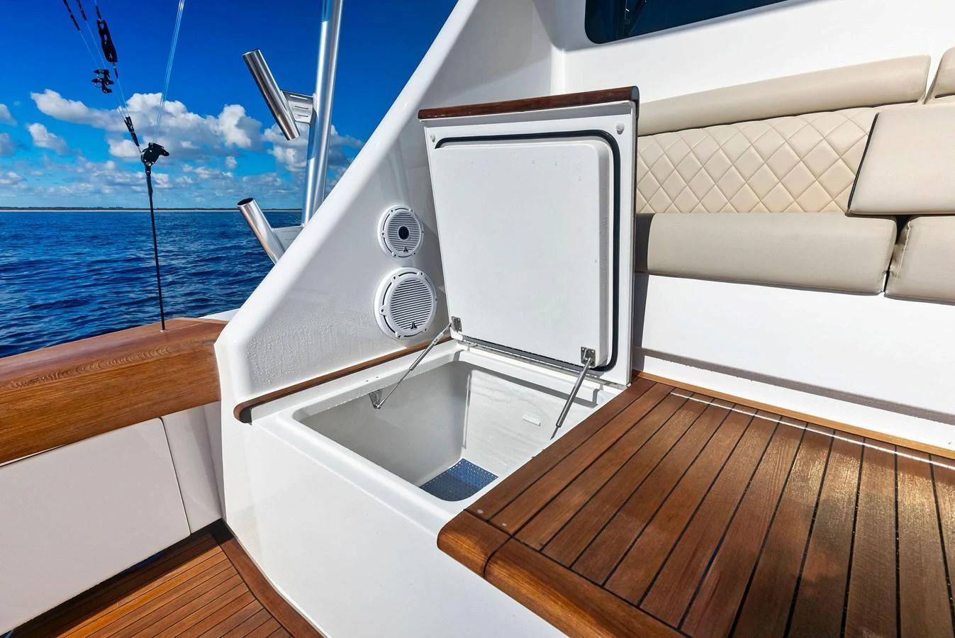 A close-up view of a yacht's built-in cooler on the deck, showcasing its practical design. aboard CATCH 23 Yacht for Sale