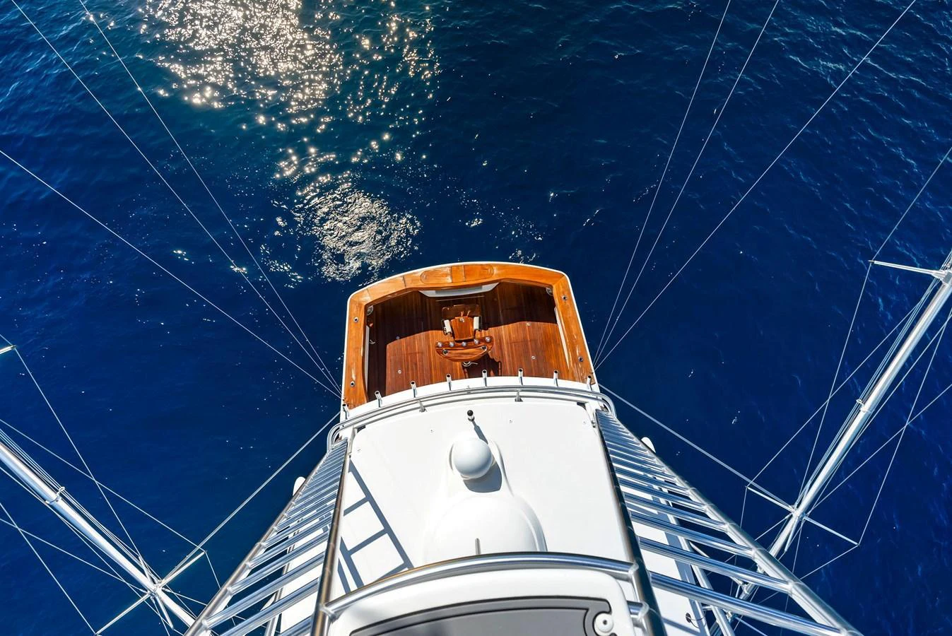 A stunning aerial view of a yacht's deck against the deep blue sea. aboard CATCH 23 Yacht for Sale
