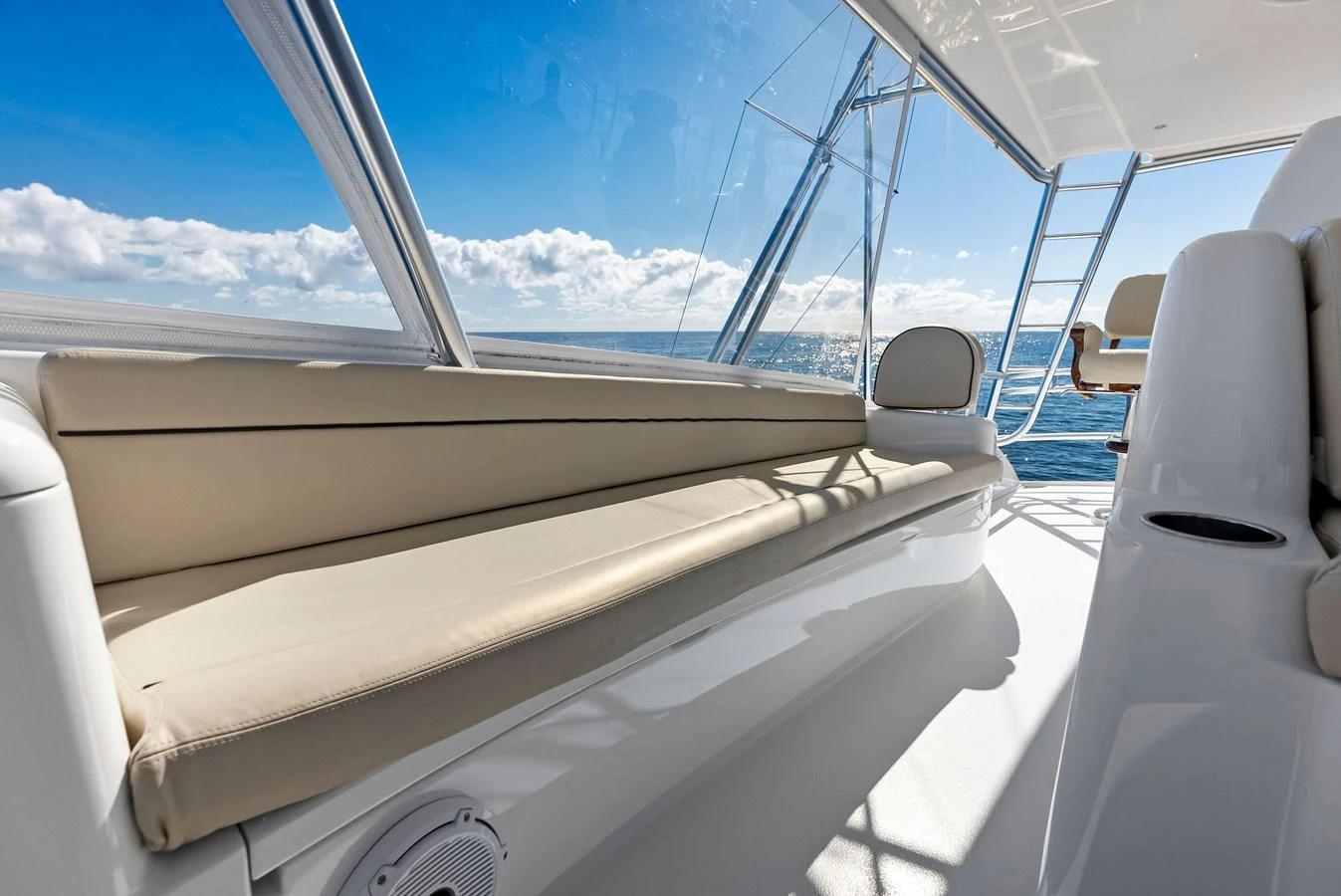 The flybridge offers a comfortable seating area with stunning ocean views. aboard CATCH 23 Yacht for Sale