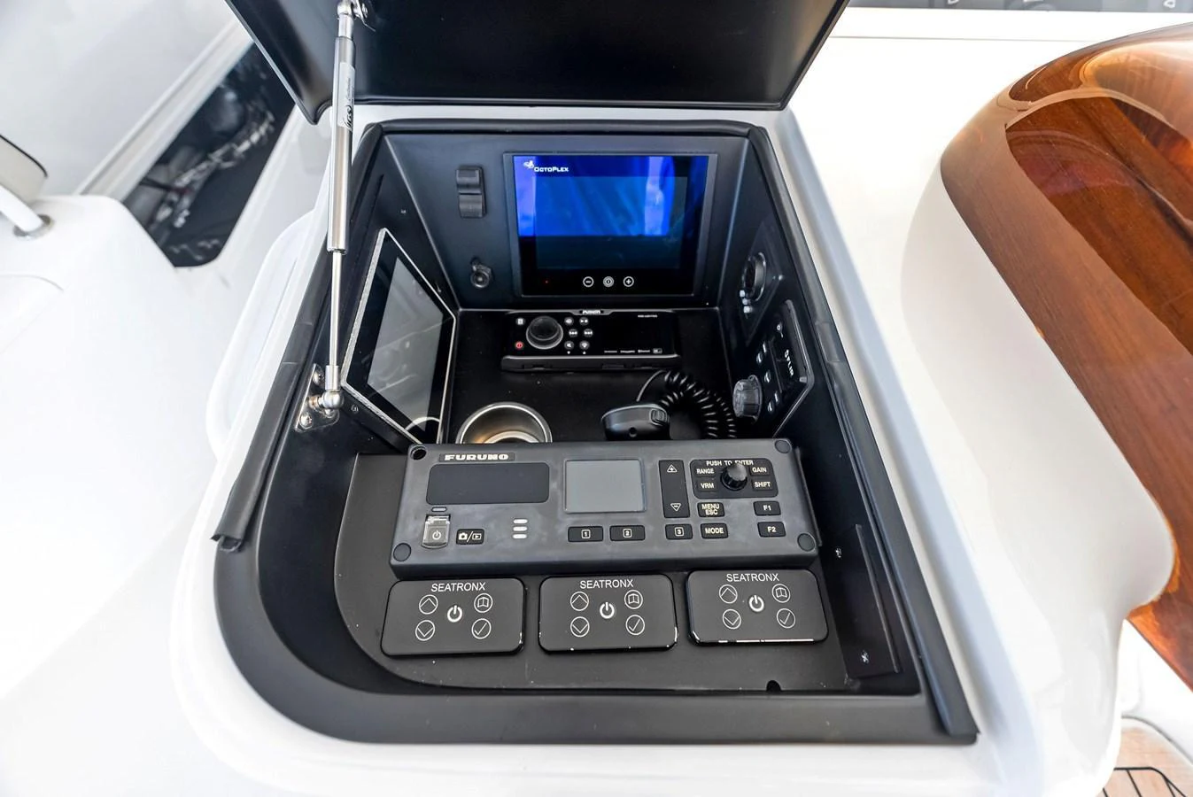 A close-up view of the yacht's control panel with various navigation and communication instruments. aboard CATCH 23 Yacht for Sale