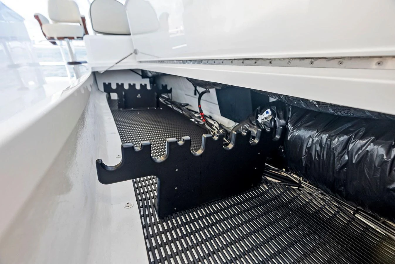 This image showcases a detailed view of the yacht's storage area with specialized racks. aboard CATCH 23 Yacht for Sale