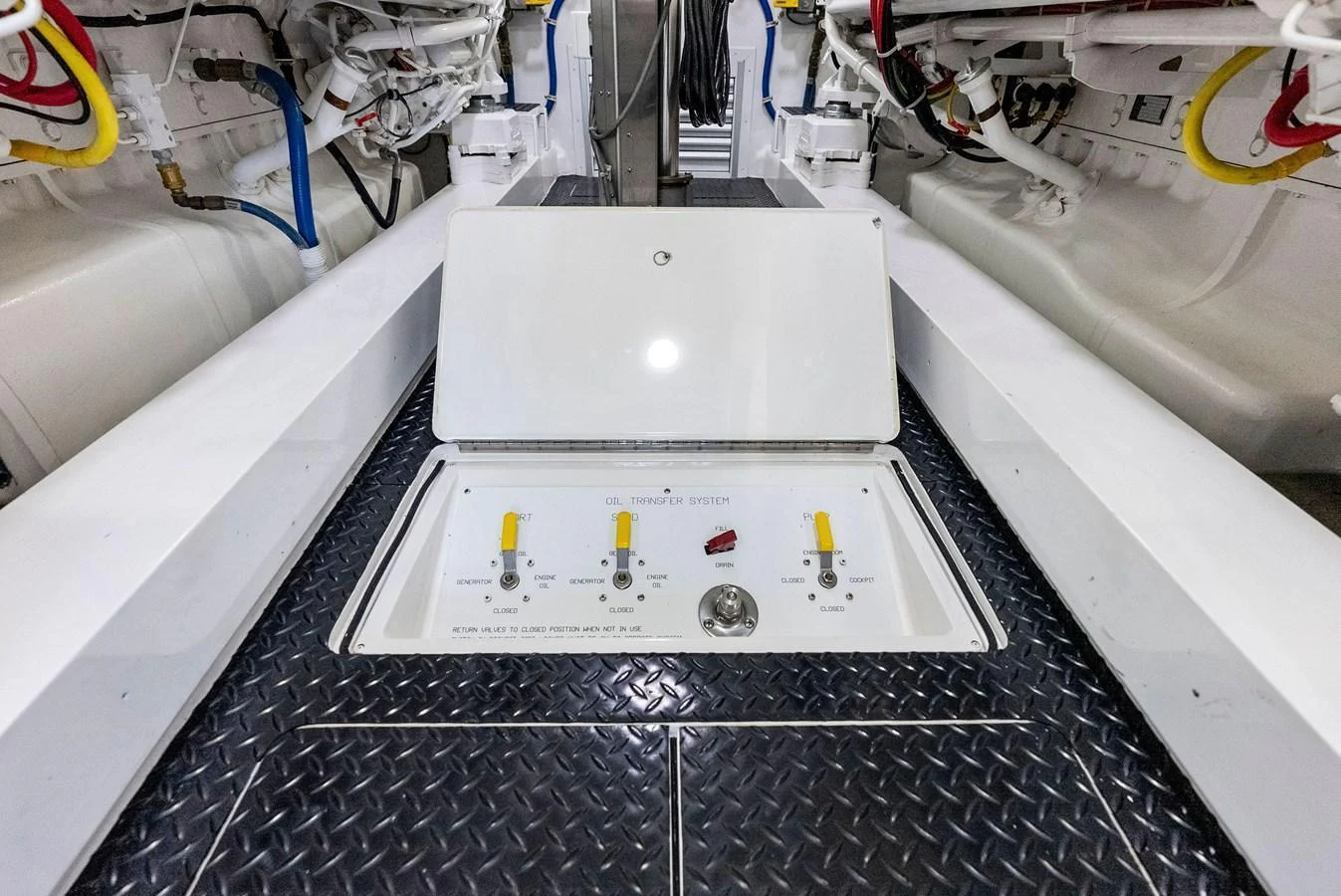 The image showcases the pristine and well-organized engine room of the yacht. aboard CATCH 23 Yacht for Sale