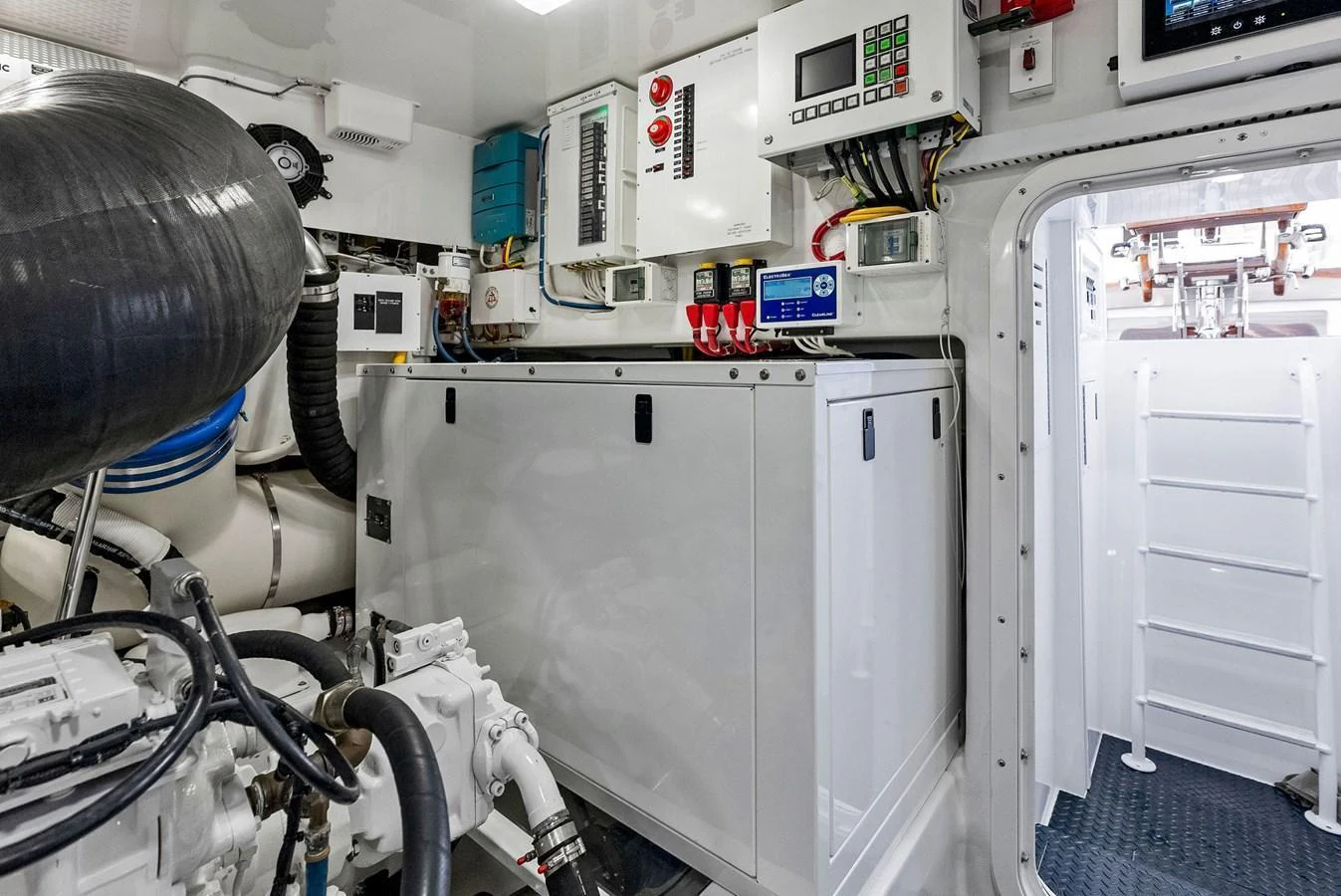 The image showcases the yacht's well-organized engine room with advanced machinery and control panels. aboard CATCH 23 Yacht for Sale
