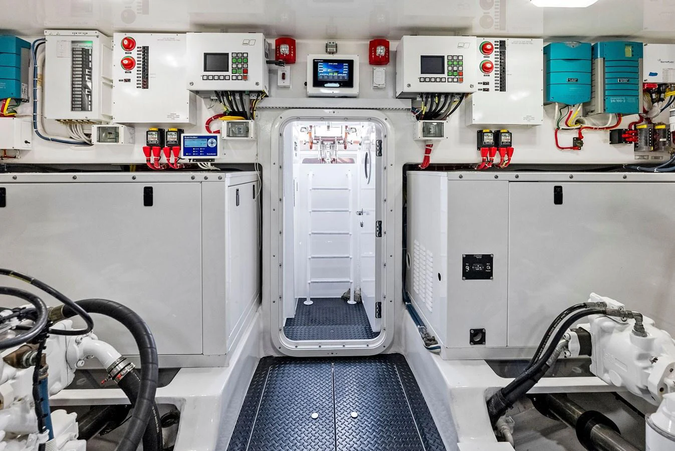 The engine room is equipped with advanced control panels and machinery, showcasing a well-organized and clean setup. aboard CATCH 23 Yacht for Sale