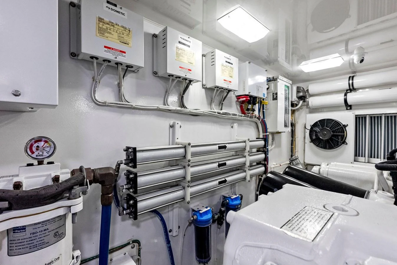 The image showcases the well-organized and clean engine room of the yacht, highlighting its technical equipment and systems. aboard CATCH 23 Yacht for Sale