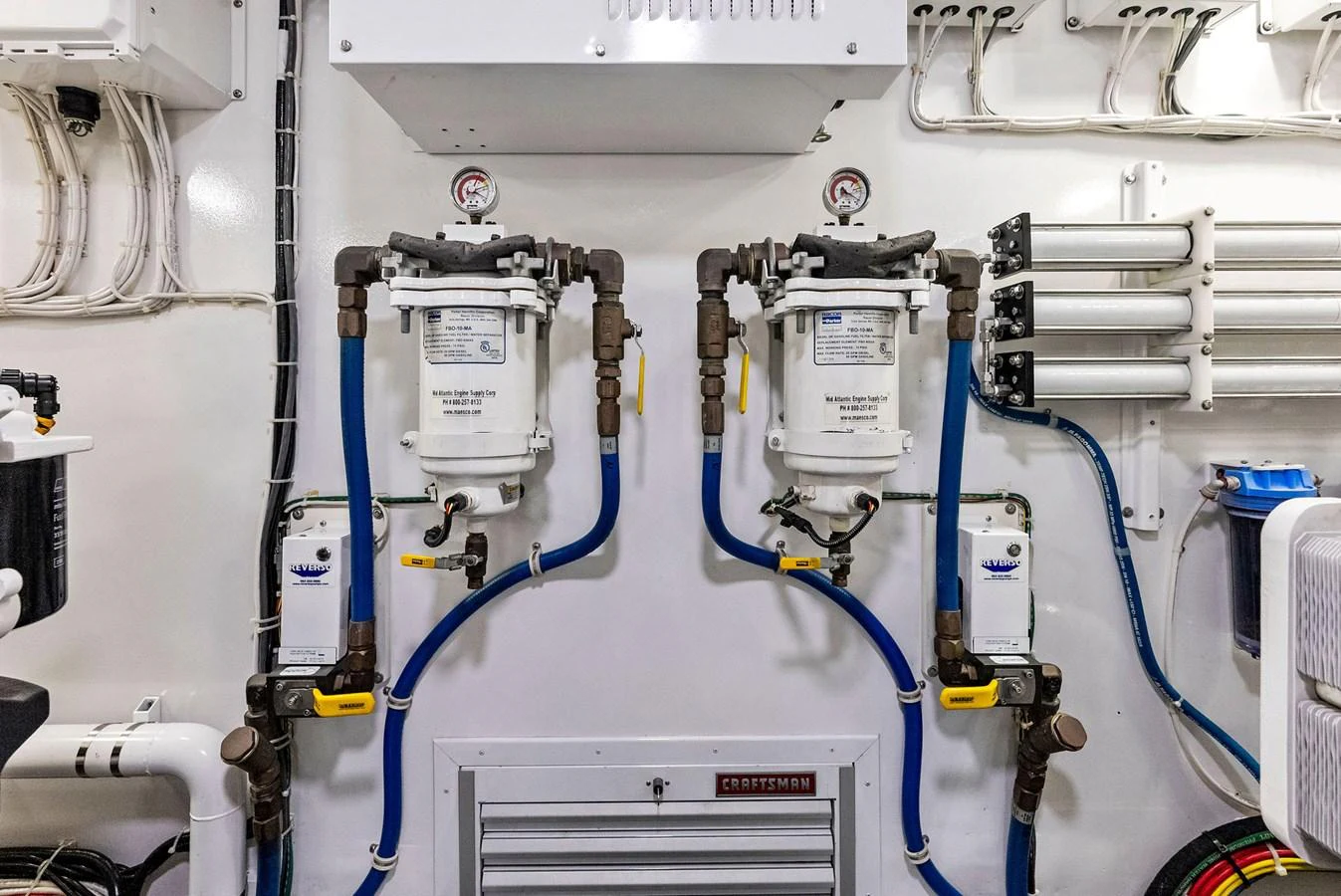 The image showcases the yacht's engine room with detailed views of the machinery and equipment. aboard CATCH 23 Yacht for Sale