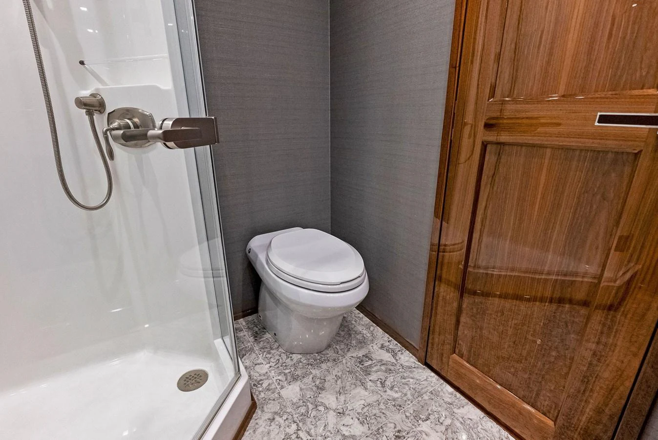 The yacht's bathroom features a modern shower and sleek fixtures. aboard CATCH 23 Yacht for Sale