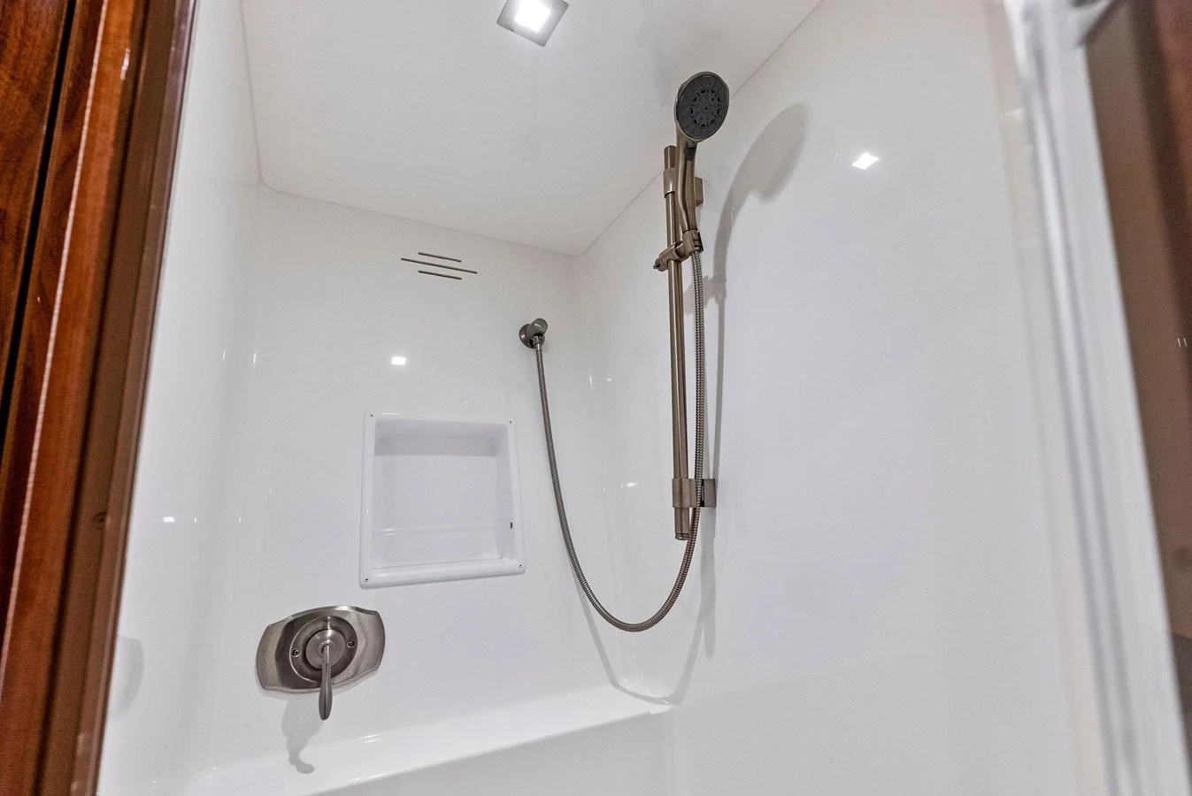 The yacht features a sleek and modern shower with high-end fixtures. aboard CATCH 23 Yacht for Sale