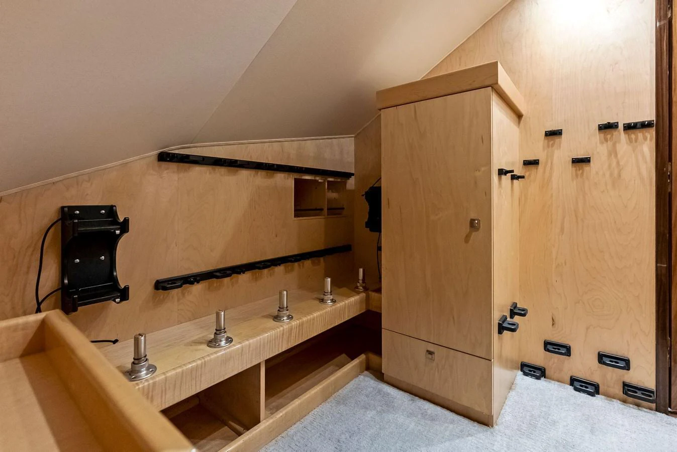 A well-organized storage area with custom fittings for secure stowage. aboard CATCH 23 Yacht for Sale