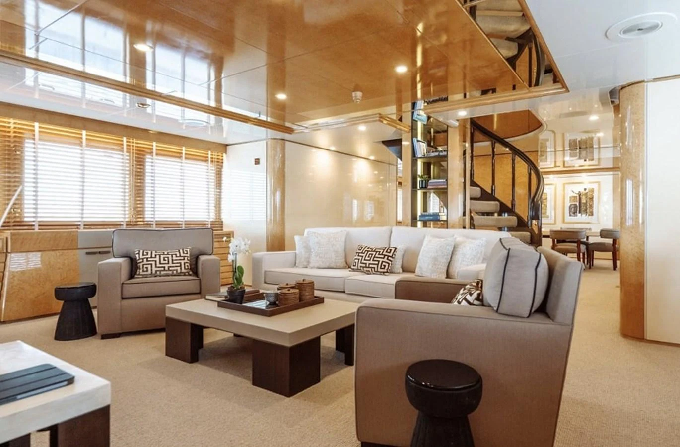 The salon offers a spacious and elegant seating area with modern furnishings and ample natural light. aboard KASSANDRA Yacht for Sale