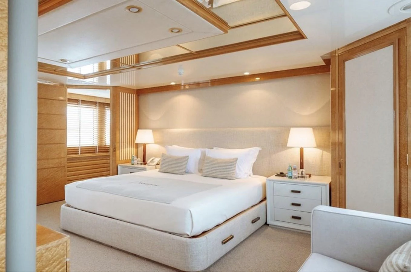 The master stateroom features a spacious bed with elegant lighting and luxurious furnishings. aboard KASSANDRA Yacht for Sale