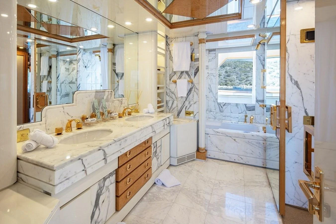The yacht's bathroom features luxurious marble finishes and elegant fixtures. aboard KASSANDRA Yacht for Sale
