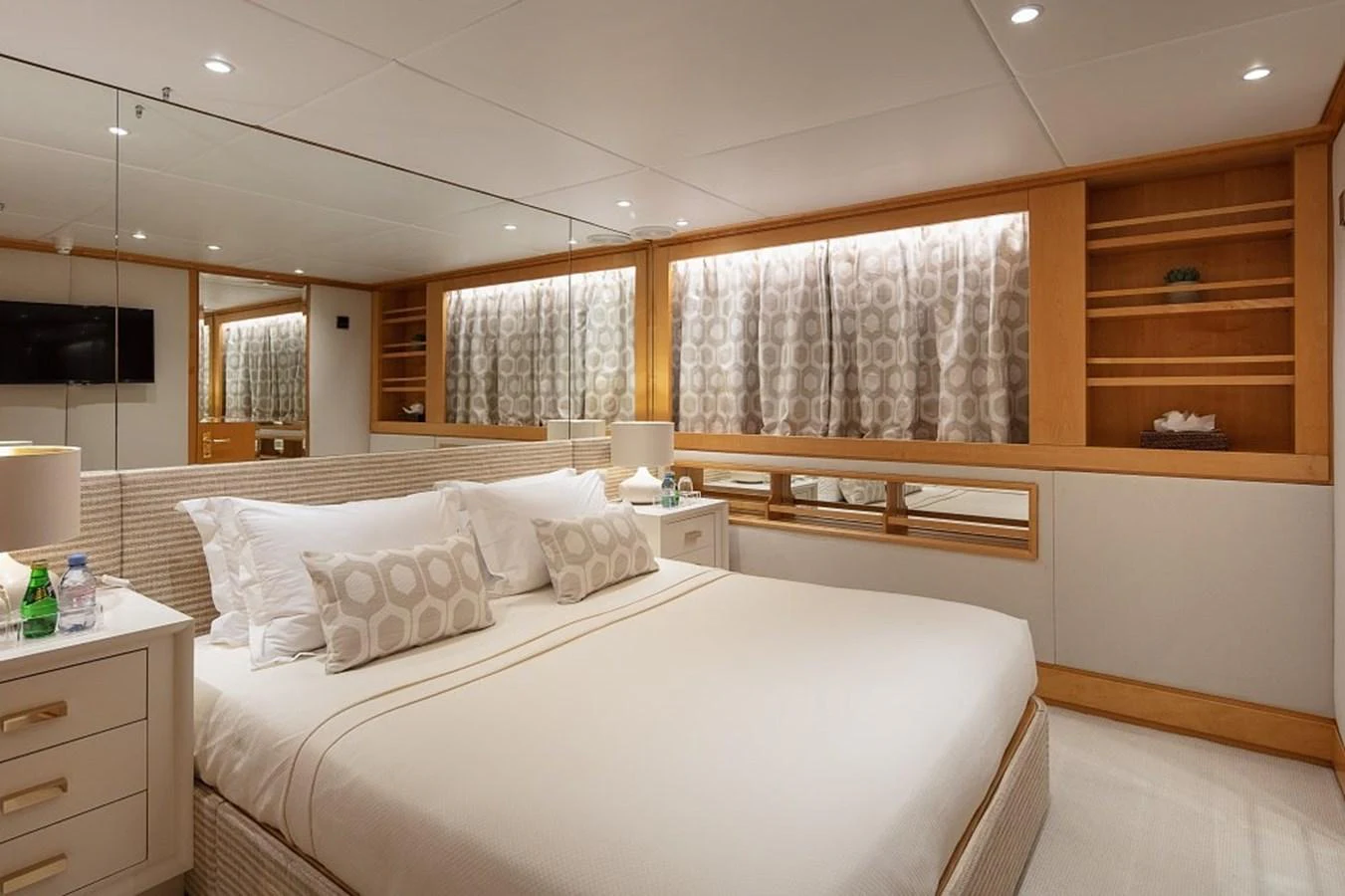 The master stateroom features a luxurious bed with elegant bedding and ample storage space. aboard KASSANDRA Yacht for Sale