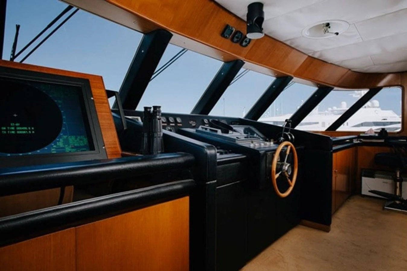 The helm station features advanced navigation equipment and a sleek, modern design. aboard KASSANDRA Yacht for Sale