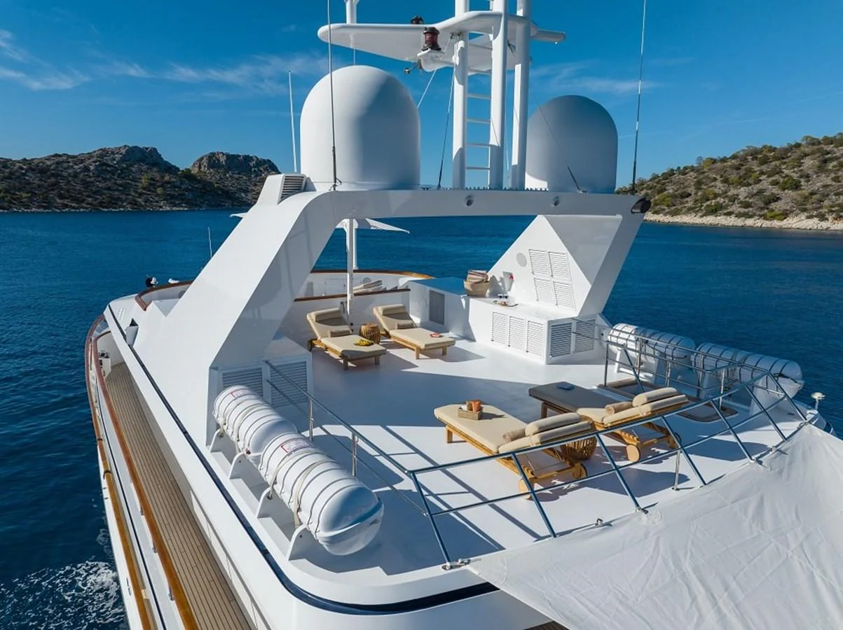 The yacht's sundeck offers luxurious lounging areas with stunning views of the surrounding waters. aboard KASSANDRA Yacht for Sale