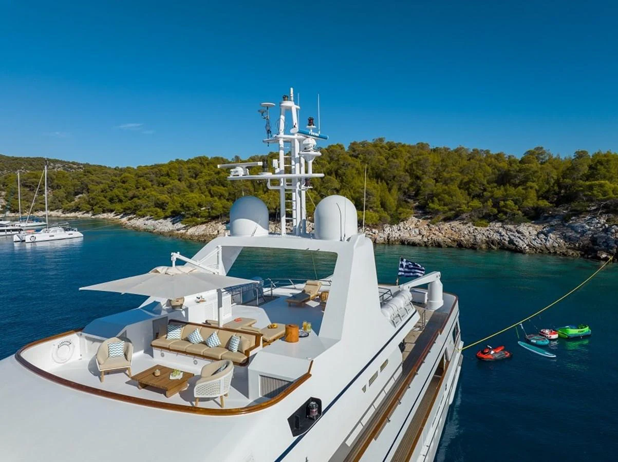 The yacht's sundeck offers a luxurious space for relaxation with stunning views of the surrounding waters. aboard KASSANDRA Yacht for Sale
