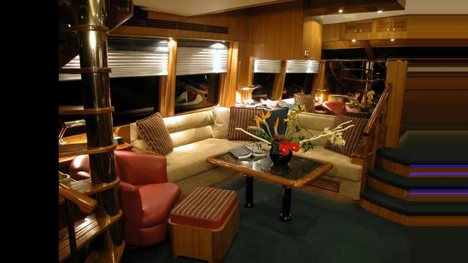The yacht's salon features a cozy seating area with plush sofas and elegant decor. aboard MIKELSON 75 SPORTFISHER Yacht for Sale